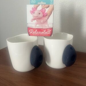 Pair of white rock climbing mugs with tea infuser